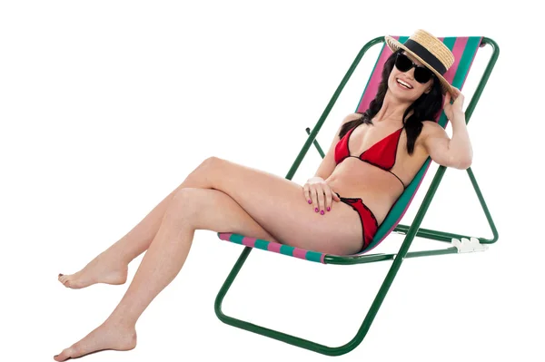 Young bikini woman relaxing on deckchair — Stock Photo, Image