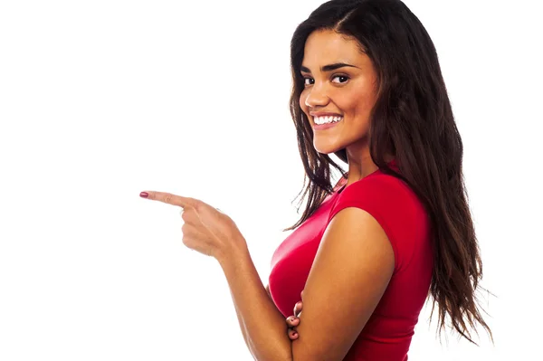 Pretty charming girl pointing away — Stock Photo, Image