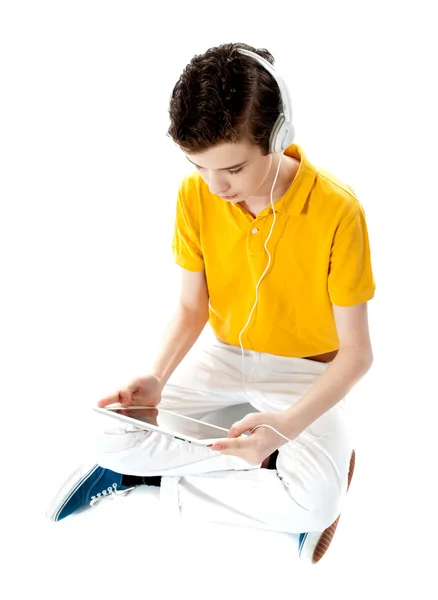 Young kid lost in his own music world — Stock Photo, Image