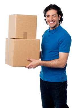 Smart young man carrying boxes clipart