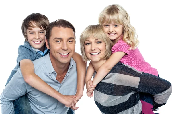 Caucasian family of four in the studio — Stock Photo, Image