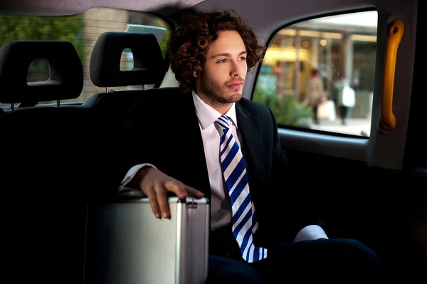 Handsome businessman inside taxi cab — Stock Photo, Image