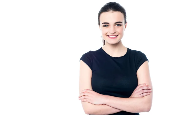 Happy young girl posing, arms crossed — Stock Photo, Image