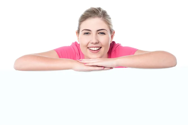 Cheerful teen behind blank whiteboard — Stock Photo, Image