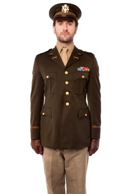 Young military officer in attention position clipart