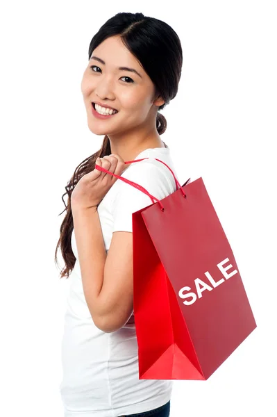 Cheerful young shopaholic girl — Stock Photo, Image