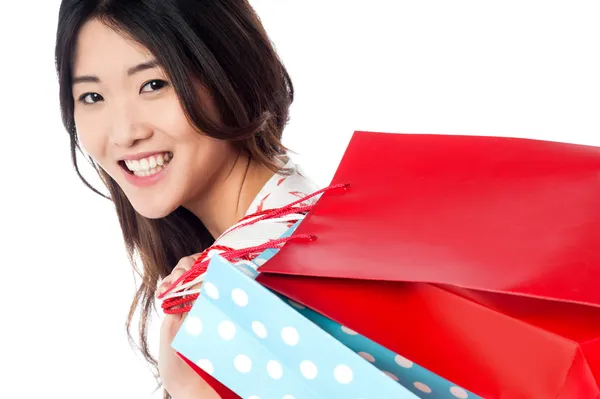 Cheerful young shopaholic girl — Stock Photo, Image