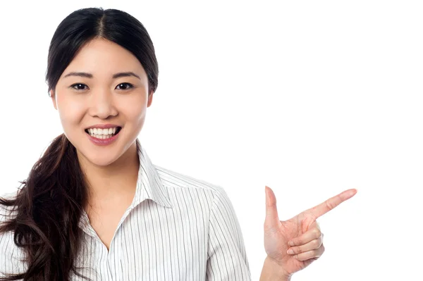 Young pretty model pointing away — Stock Photo, Image