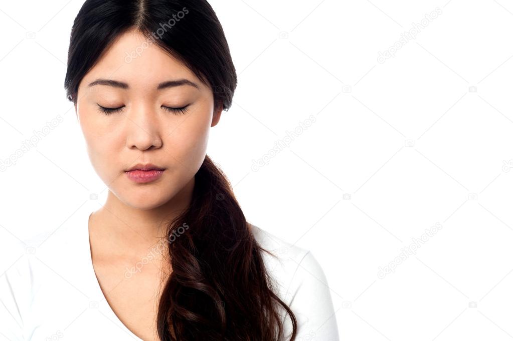 Young girl with closed eyes at peace