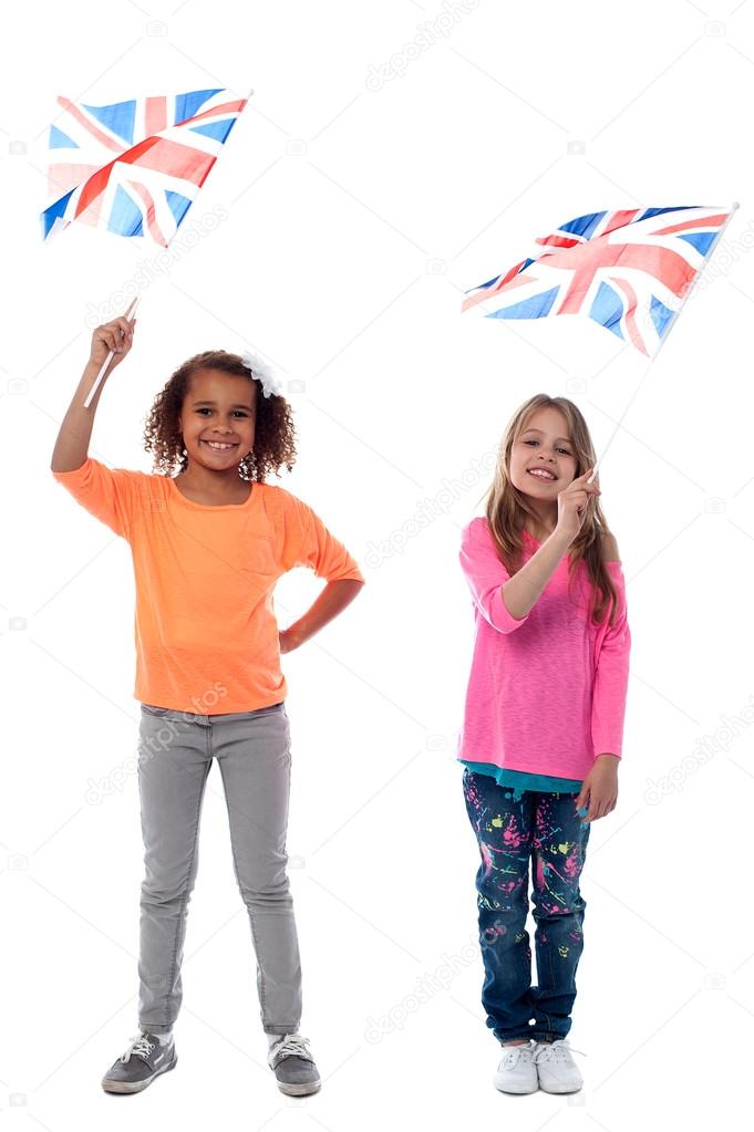 Girls waving United Kingdom flags