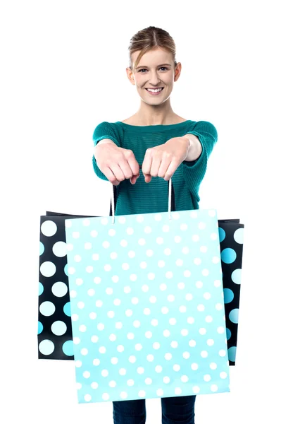 Young shopaholic girl with vibrant bags — Stock Photo, Image