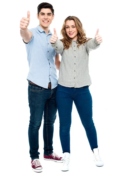 Attractive couple showing thumbs up — Stock Photo, Image