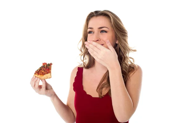 Pretty girl enjoying yummy pizza slice — Stock Photo, Image