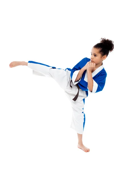 Small kid practicing karate kick — Stock Photo, Image