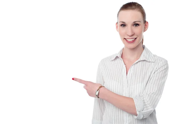 Corporate lady pointing at something — Stock Photo, Image