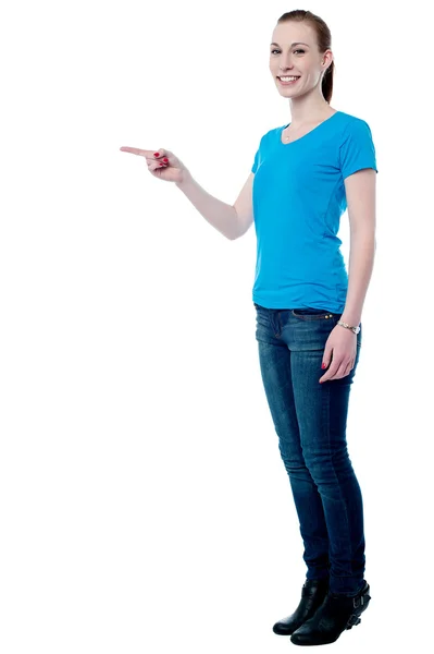 Young lady pointing away — Stock Photo, Image