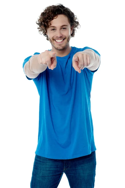 Smiling young guy pointing at you — Stock Photo, Image