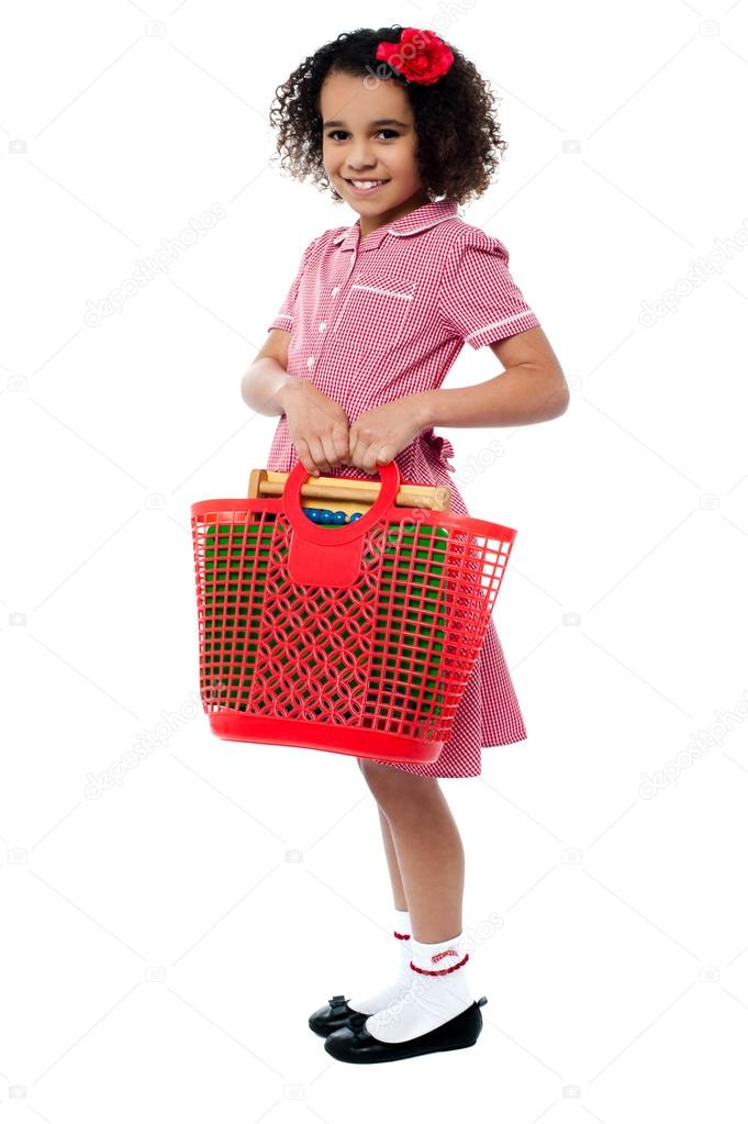 Charming kid carrying school stationery