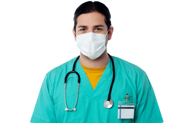 Young male surgeon wearing a face mask — Stock Photo, Image