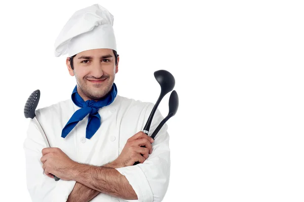 Chef holding kitchen essentials — Stock Photo, Image