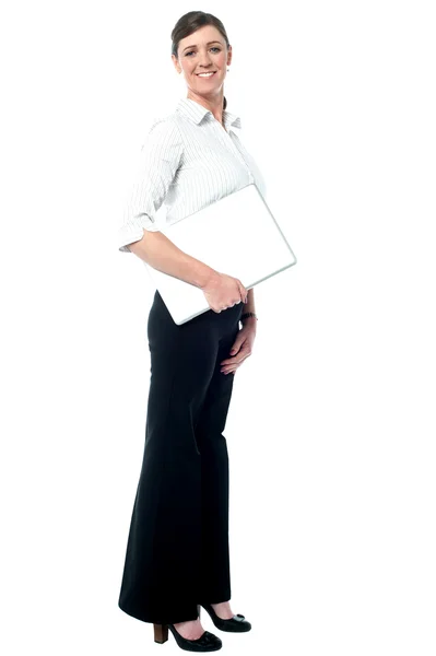 Corporate lady holding laptop — Stock Photo, Image