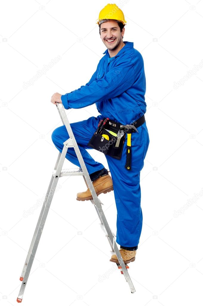Construction worker climbing up the step ladder