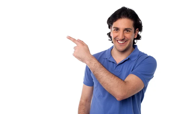 Handsome man pointing at something — Stock Photo, Image