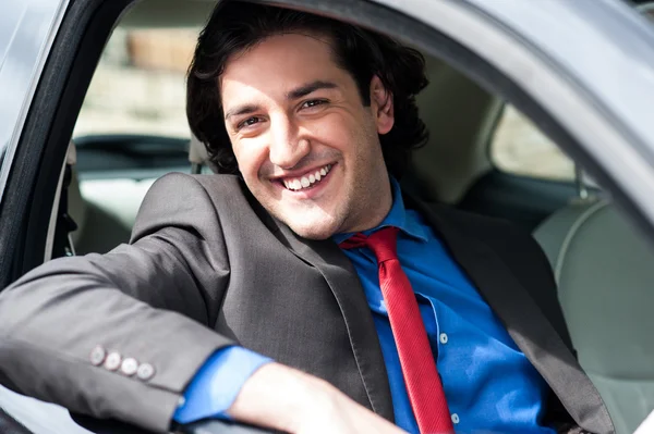 Portrait of handsome guy driving his car — Stock Photo, Image