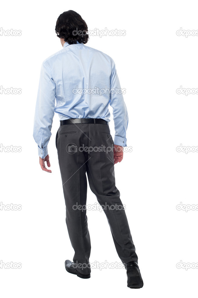 Young businessman in walking posture