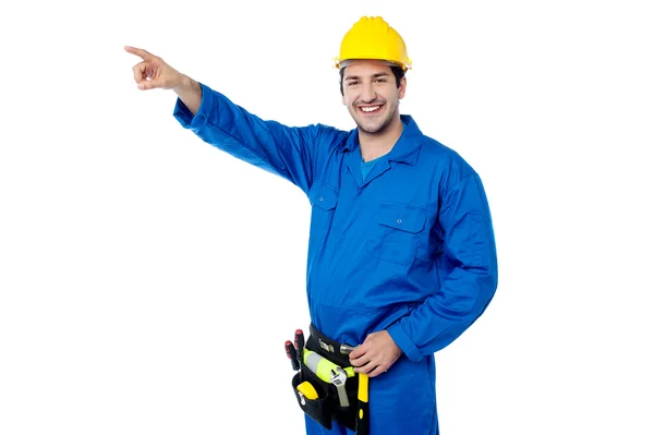 Construction worker pointing away — Stock Photo, Image
