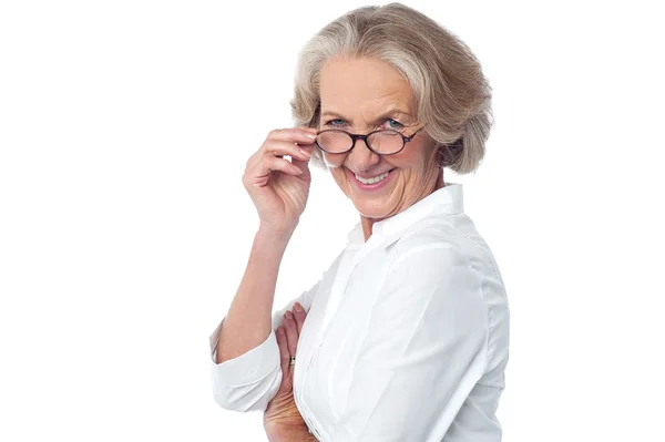 Attractive aged woman looking at you — Stock Photo, Image