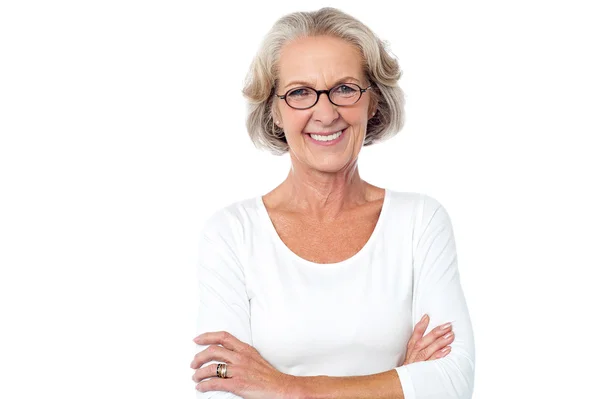 Beautiful aged woman with crossed arms — Stock Photo, Image