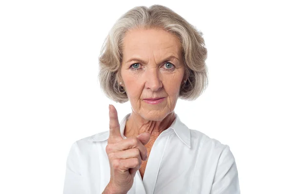 Angry aged woman warning you. — Stock Photo, Image