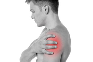 Guy holding his shoulder in pain