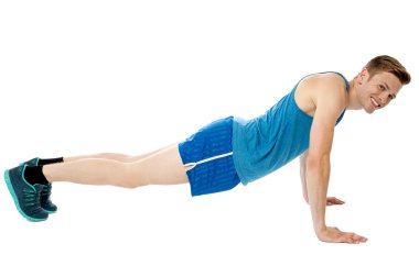 Man doing push-ups exercise in gym clipart
