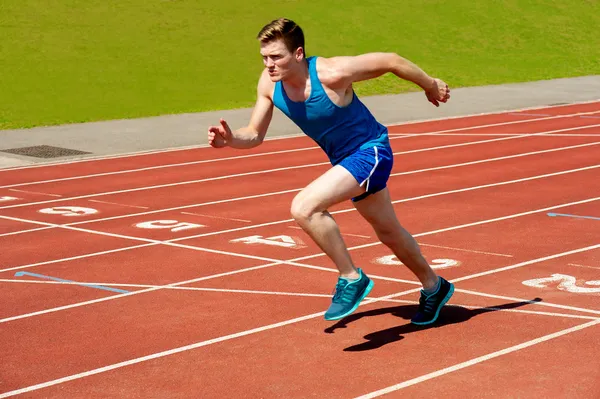 Male runner on starting blocks — Stock Photo, Image