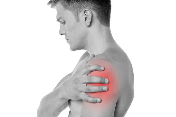 Guy holding his shoulder in pain — Stock Photo, Image