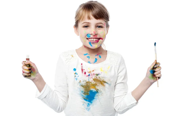 Cheerful kid with paint and brush — Zdjęcie stockowe