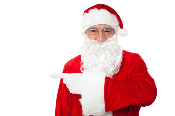 Санта Клаус указывает на — стоковое фото