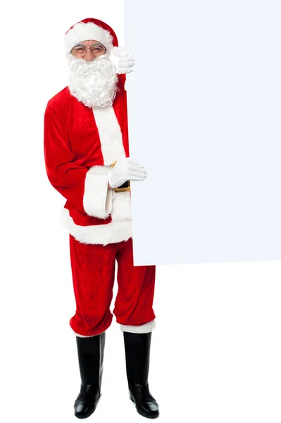 Male santa holding whiteboard — Stock Photo, Image