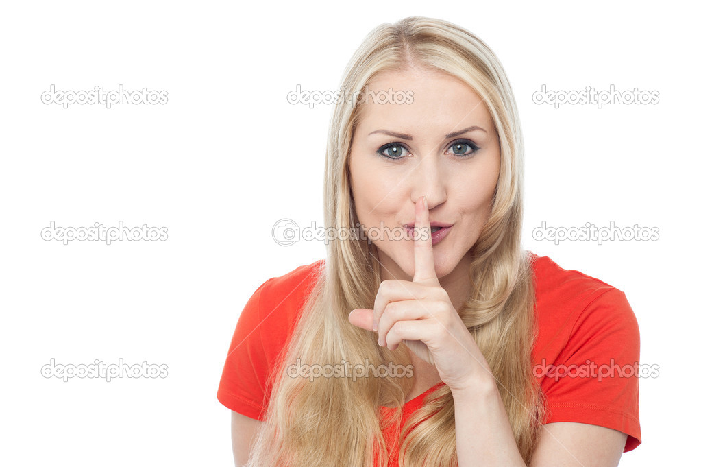 Young beautiful woman gesturing silence