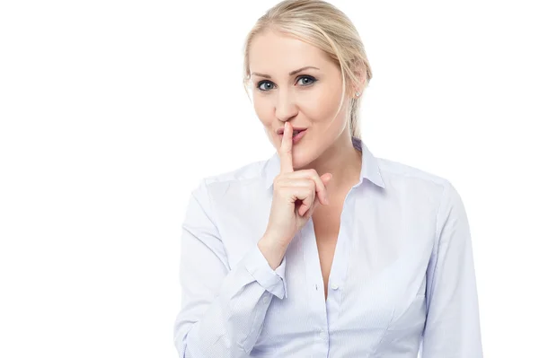 Silence gesture by young corporate lady — Stock Photo, Image