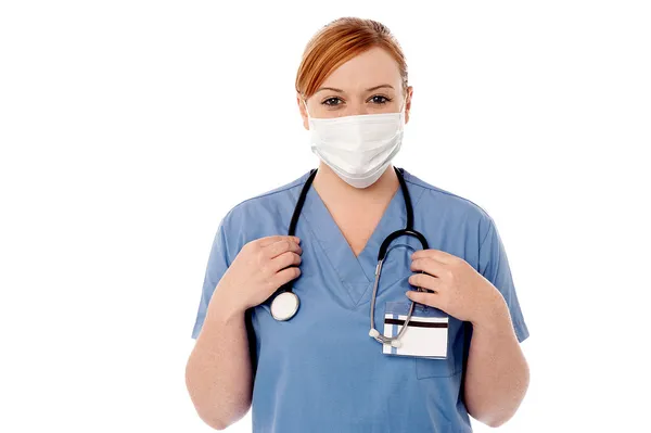 Female surgeon wearing face mask — Stock Photo, Image