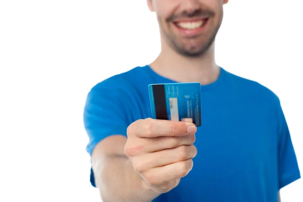 Cropped image of a man displaying his cash card Stock Picture