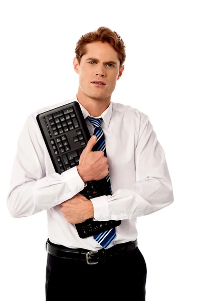 Corporate man holding keyboard — Stock Photo, Image