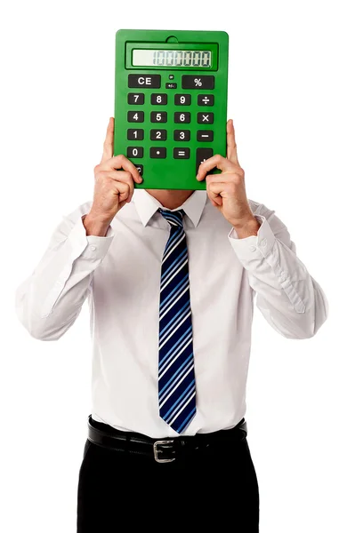 Guy hiding his face behind big calculator — Stock Photo, Image