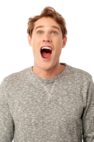 Amazed young guy with open mouth — Stock Photo, Image