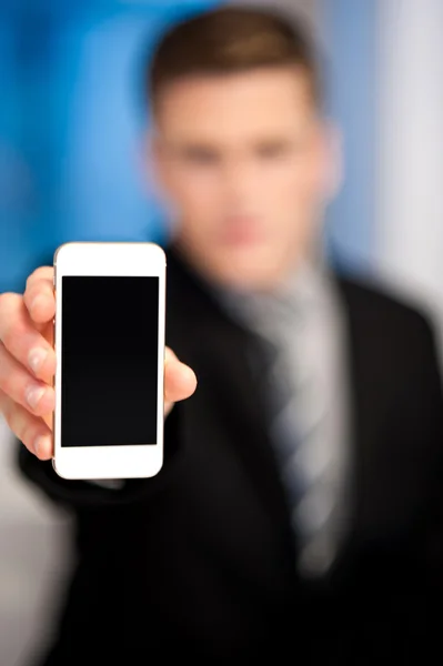 Salesman displaying newly launched mobile — Stock Photo, Image
