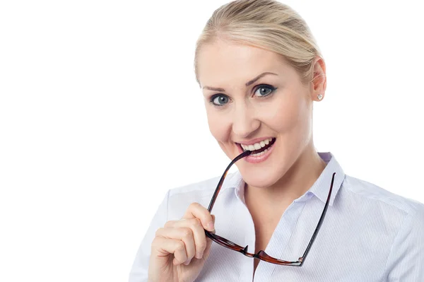 Mischievous smiling young corporate woman — Stock Photo, Image