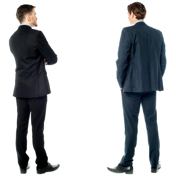 Back pose of handsome young corporates — Stock Photo, Image